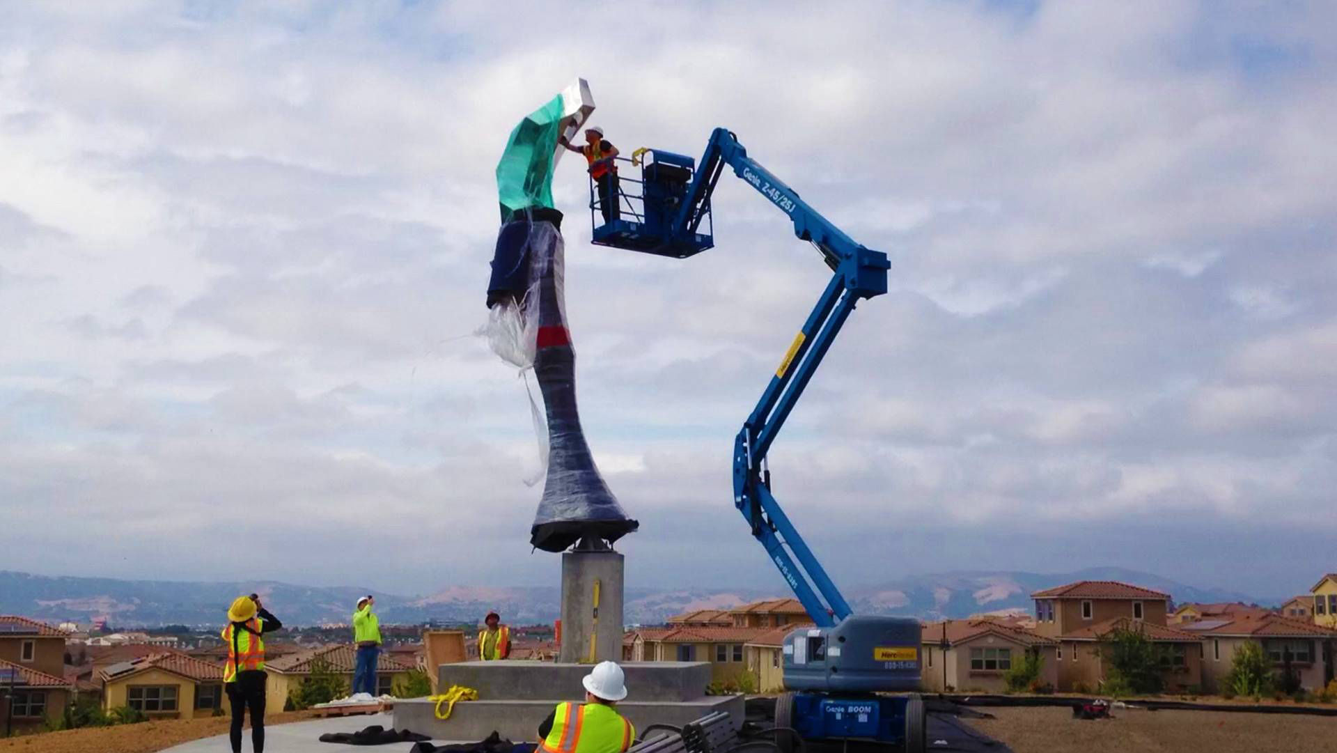 Heath Satow Sculpture - Installing Elatus, a polished stainless steel art sculpture by Heath Satow in Dublin, CA