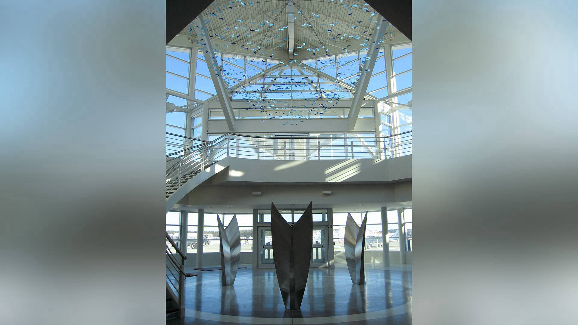 Dream of Flight stainless steel stained glass public art sculpture by Heath Satow RDU Airport NC