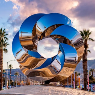 Revolution - Mirror-polished stainless steel public art sculpture by Heath Satow Palmdale California