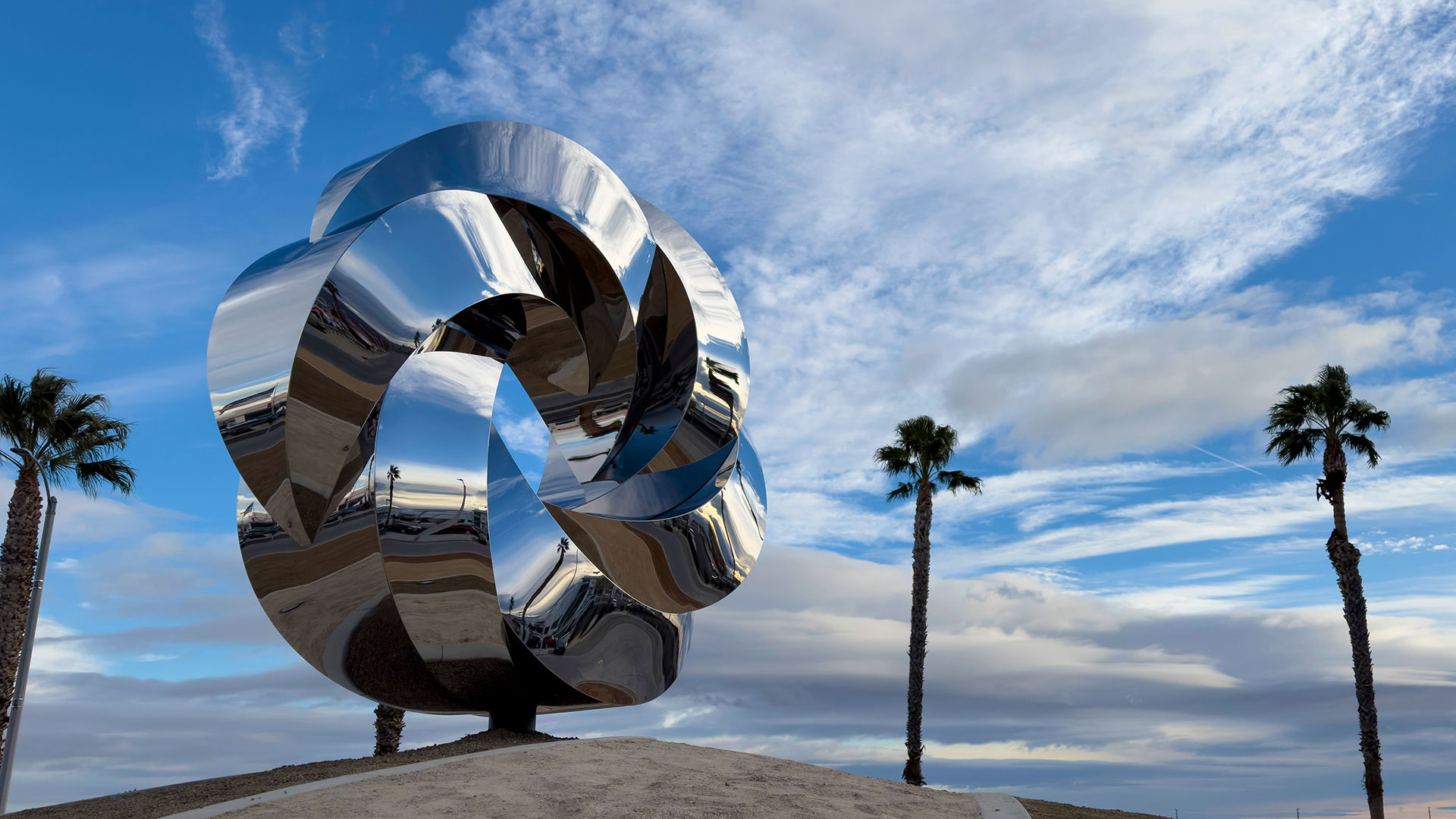 Polished stainless steel public art sculpture by Heath Satow Palmdale California